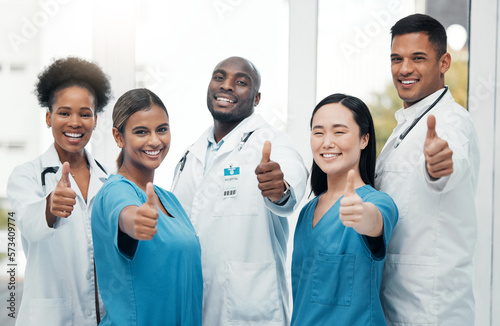 Nurses, doctors and thumbs up portrait of healthcare team for success, support and thank you. Hand sign of diversity women and men happy for medical teamwork in hospital with trust and care