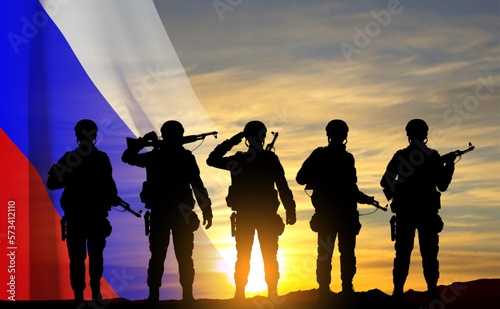 Silhouettes of russian soldiers on background of sunset with the Russian flag. Military recruitment concept. EPS10 vector