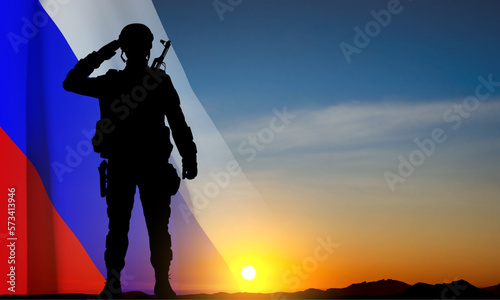 Silhouette of russian soldier on background of sunset with the Russian flag. Military recruitment concept. EPS10 vector