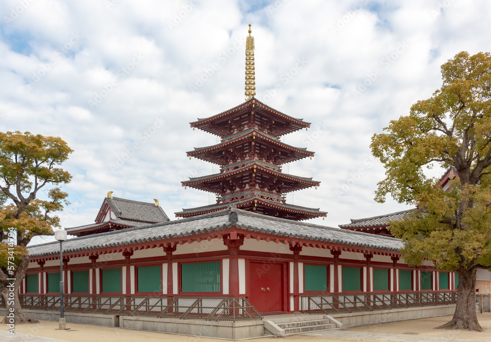 Red and gold colorful temple traditional architecture building and pagoda at the Shi-Tennoji Buddhist Temple in Osaka Japan
