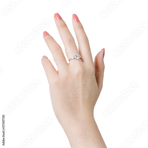 Close up fingers of woman with pink polished nails wearing an expensive engagement diamonds ring.