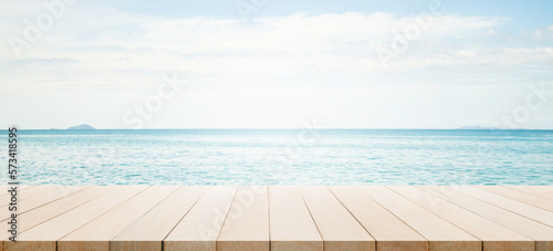 Summer Table on Sea Background Bar Counter Wooden on Ocean with Cloud Blue Sky on Sun Day Empty Desk Mockup on water Nature Outdoor for Travel Tropical Holiday Counter Bar Free Space for Presentation.
