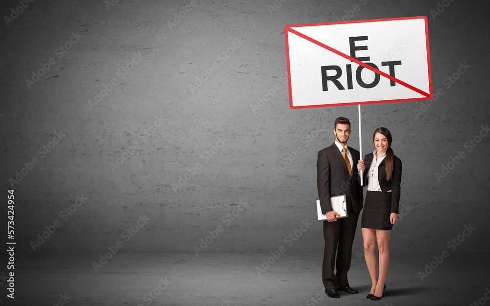 business person holding a traffic sign business person holding a traffic sign