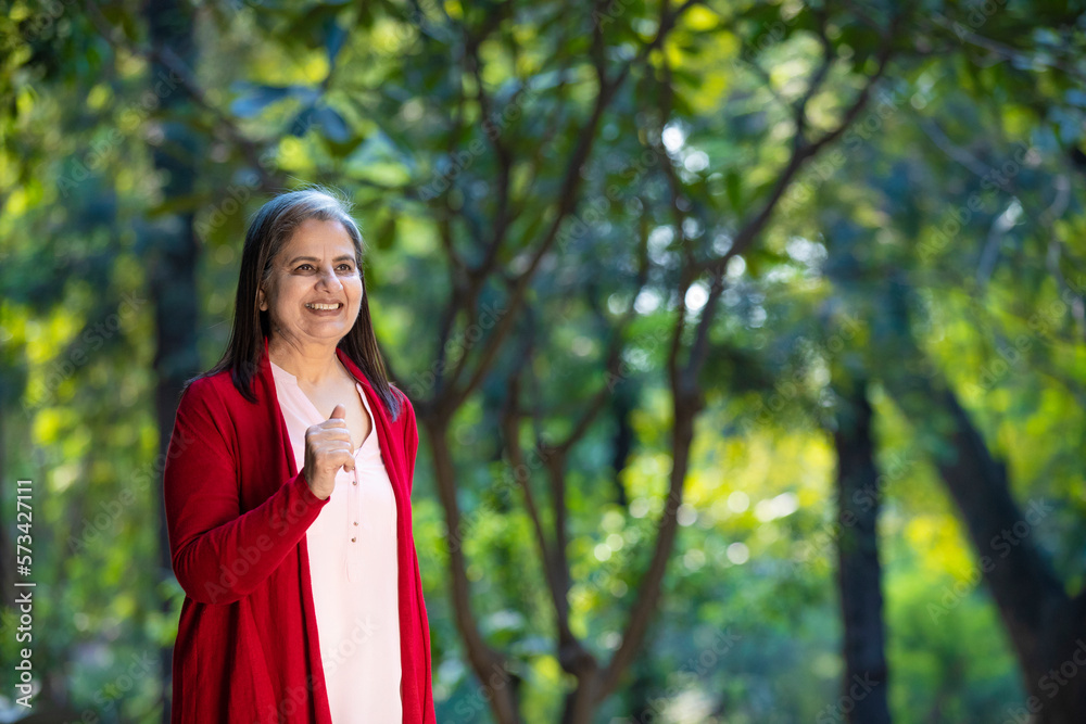 Indian senior woman doing exercise or jogging at park. Indian senior woman doing exercise or jogging at park.