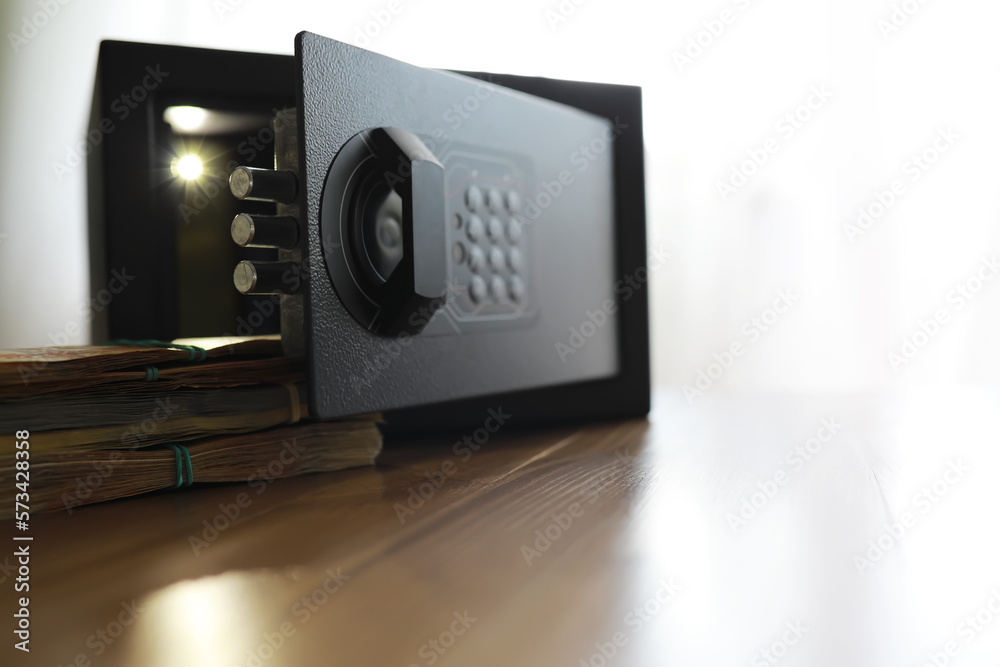 money in a residential safe close-up photo. Deposit in cash. Russian rubles are in the safe money in a residential safe close-up photo. Deposit in cash. Russian rubles are in the safe