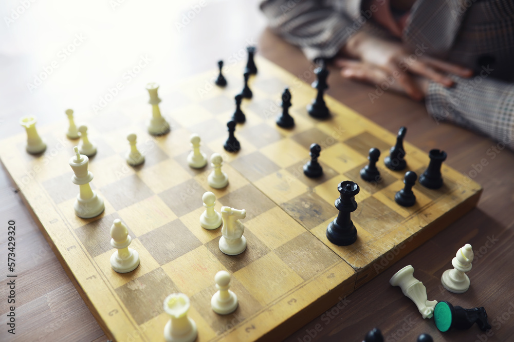 Hand playing game of chess, competition, strategy, battle, play Hand playing game of chess, competition, strategy, battle, play