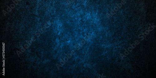 Dark Blue background with grunge backdrop texture, watercolor painted mottled blue background, colorful bright ink and watercolor textures on white paper background. © MdLothfor