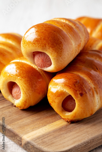 Homemade Kolache Rolls Ready to Eat on a Wooden Board, side view. Close-up. photo