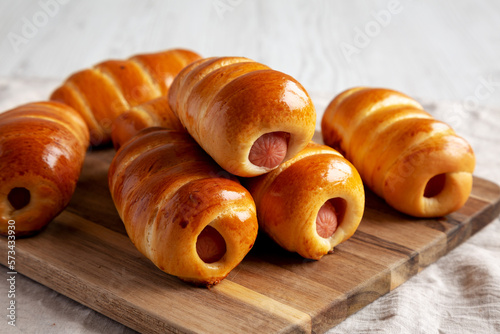 Homemade Kolache Rolls Ready to Eat on a Wooden Board, side view. Close-up. photo