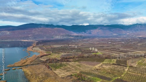 Flying over agricultural fields and the calm waters of lake Vegoritida in Macedonia province, Greece photo