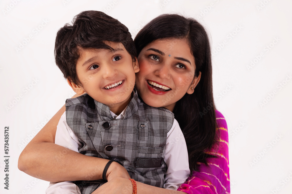 Portrait of smiling mother and son together against white background Portrait of smiling mother and son together against white background