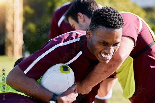 Sports, team and rugby game on a field by men in training, practice or match outdoors. Fitness, group and players with ball for exercise, workout and performance, challenge and competitive athletics