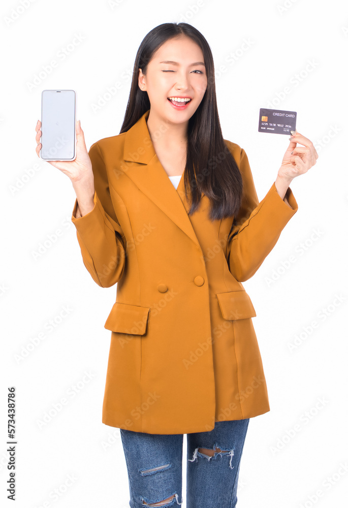 pretty asian woman smile showing, presenting credit card for payment or paying online in holding mobile phone payment credit card for confident money and financial concepts . pretty asian woman smile showing, presenting credit card for payment or paying online in holding mobile phone payment credit card for confident money and financial concepts .