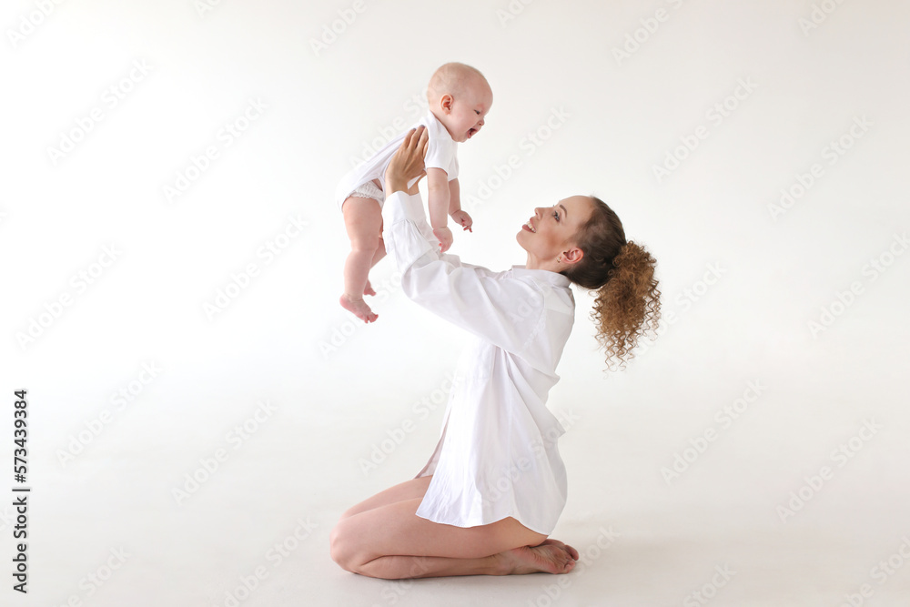 Mother and little boy son closeup portrait, happy faces on background, mom and kid having fun indoors, parents lifestyle, woman holding little baby, healthy kid and mom, concept happiness and family