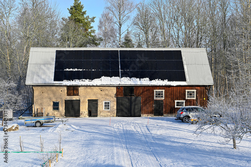 solar panels on barn roof a cold winter day photo