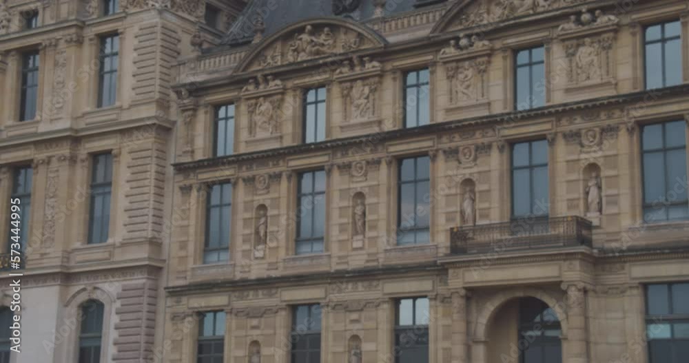 Young Woman Leaping Outdoor In Paris, France. École du Louvre In Background. slowmo Young Woman Leaping Outdoor In Paris, France. École du Louvre In Background. slowmo
