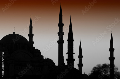 Turkish Istanbul Islamic architecture of domes and minarets silhouetted at night, an iconic cityscape skyline of the ancient ottoman capital and second city of Turkey.
