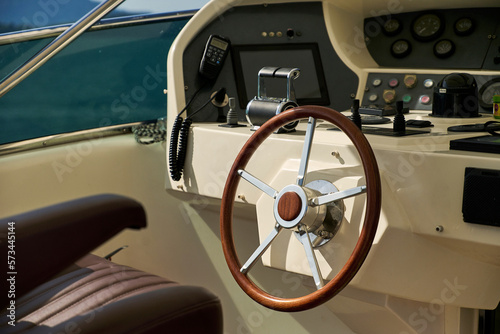 wooden yacht steering wheel with remote control © Iaroslav