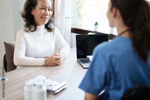 Free Download Portrait of a female doctor holding a patient clipboard to discuss and analyze the patient's condition before treating. - GFXLoad