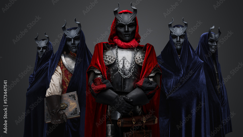 Studio shot of five members of occult brotherhood against gray background. Studio shot of five members of occult brotherhood against gray background.