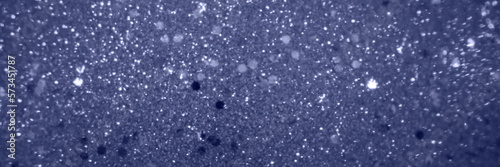 Abstract blurred violet background with shine diamond particles, magic glitter banner with copy space for festive design