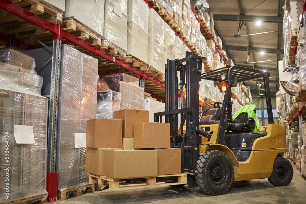 Background image of forklift truck in warehouse interior with tall shelves, copy space