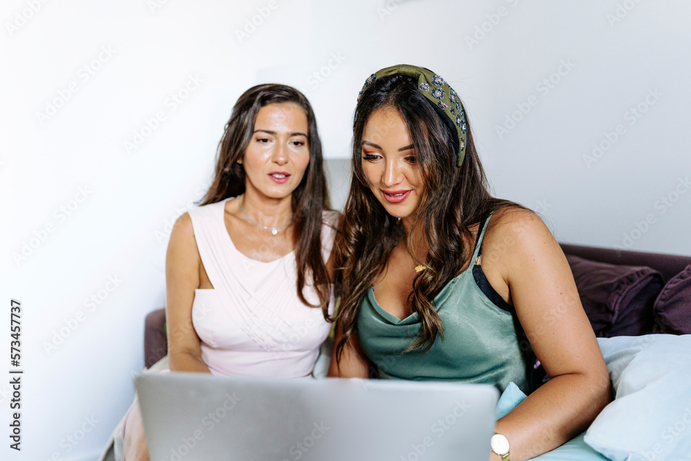 Freelancers together working on laptop at home Freelancers together working on laptop at home