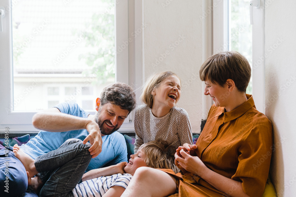 Happy family enjoying together sitting at home Happy family enjoying together sitting at home