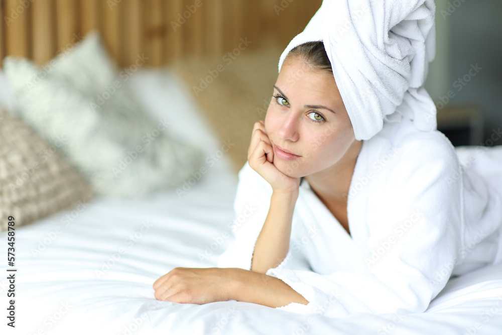 Beautiful woman after showering on a bed Beautiful woman after showering on a bed