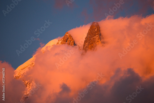 Pink evening light (Alpenglow) on the famous Drus mountain, as seen from Chamonix.