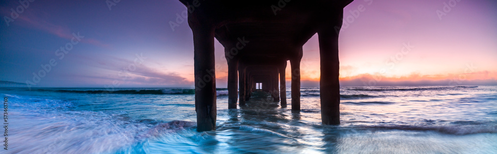 Panoramic sunset view from underneath of Manhattan Beach Pier, Los Angeles, USA Panoramic sunset view from underneath of Manhattan Beach Pier, Los Angeles, USA