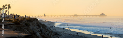 Panorama of Huntington Beach with pier in background at sunset, California, USA photo