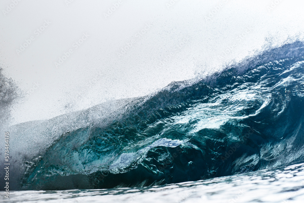An empty wave breaks over a shallow reef An empty wave breaks over a shallow reef