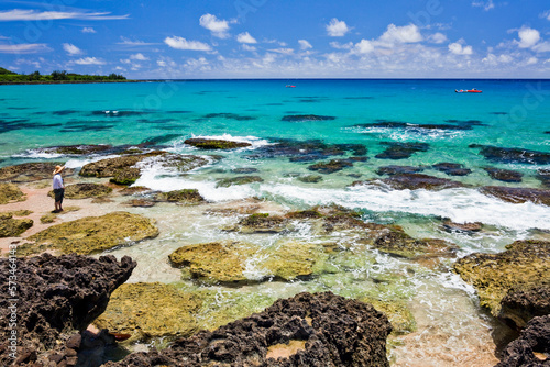 Beautiful scenery of Baishawan coastal reef and sea waves with the azure sky in the Kenting National Park, Pingtung, Taiwan. photo