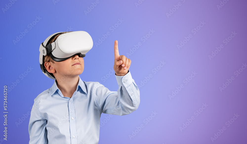 Kid boy standing with vr glasses headset, copy space gradient background