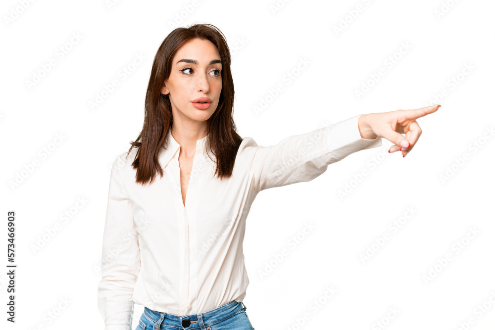 Young caucasian woman over isolated chroma key background pointing away Young caucasian woman over isolated chroma key background pointing away