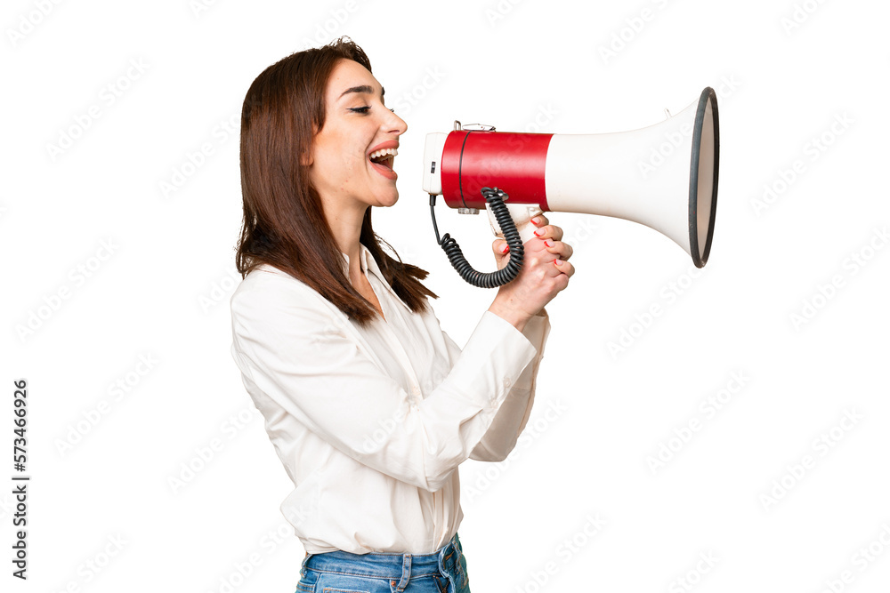 Young caucasian woman over isolated chroma key background shouting through a megaphone Young caucasian woman over isolated chroma key background shouting through a megaphone