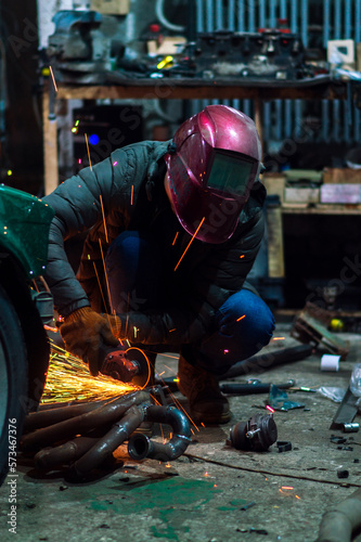 long exposure photo car repair, installation of rear disc brakes instead of drums, welding, locksmith and turning works 