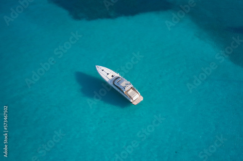 White big motor boat, top view. Anchorage white boat on transparent water top view.