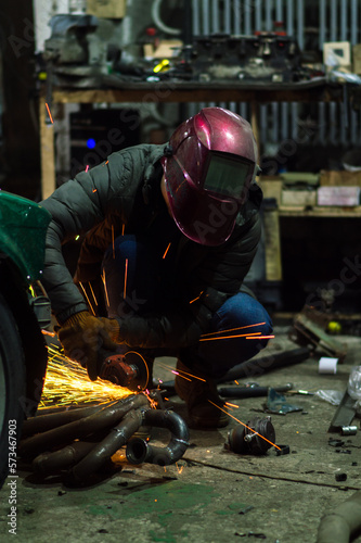 long exposure photo car repair, installation of rear disc brakes instead of drums, welding, locksmith and turning works 