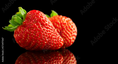 Wallpaper Mural Strawberries isolated on a black background. Two Fresh ripe strawberries on black. Macro shot Torontodigital.ca