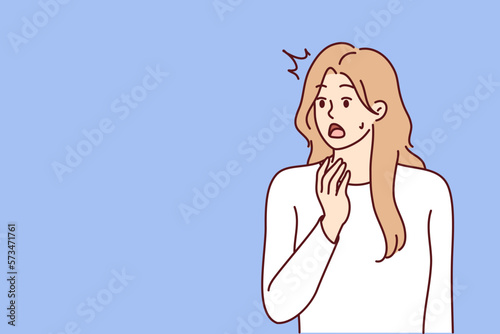 Young woman opens mouth when she sees unexpected event or experiences shock reaction after harsh statement. Girl is shocked by unexpected news about moving crisis or upcoming problems in labor market 