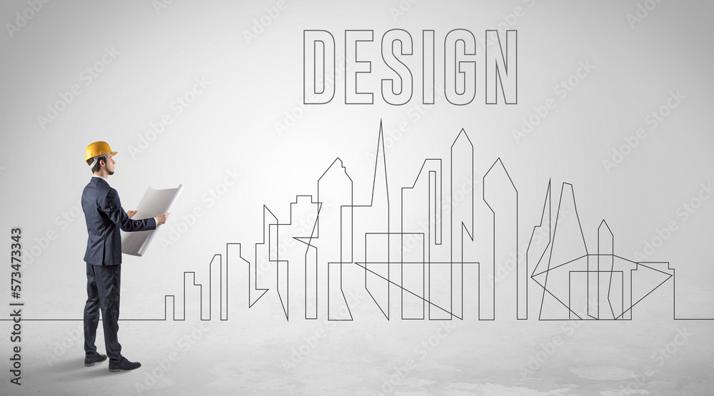 Businessman in hard hat holding blueprint Businessman in hard hat holding blueprint