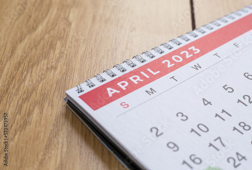 Closeup shot of a 2023 calendar, "April page". Selective focus shot of a calendar, focused on "April, 2023".
