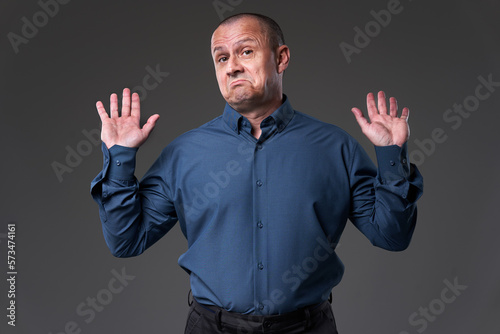 Impartial businessman on gray background
