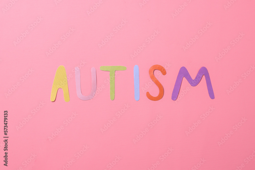 Colorful autism lettering isolated on pink background. Autism awareness. World Autism Awareness Day.