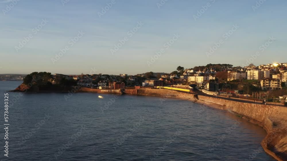 Intercity south coast train aerial view from drone wit beach and hotels UK 4K Intercity south coast train aerial view from drone wit beach and hotels UK 4K