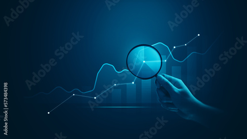 Analytics hologram hand financial chart data business graph finance on information dashboard diagram background of digital marketing analysis growth report or economy strategy stock analyzing profit. photo