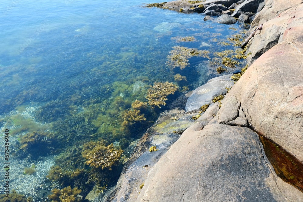 rocky coastline, huge stone in the water