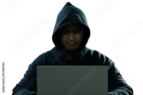 anonymous young man hacker sitting playing laptop with lots of money lying around.Concept Massive financial theft transparent background. png.file